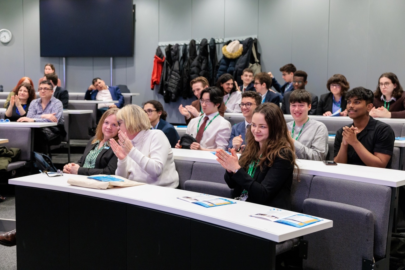 The audience applauding a presentation